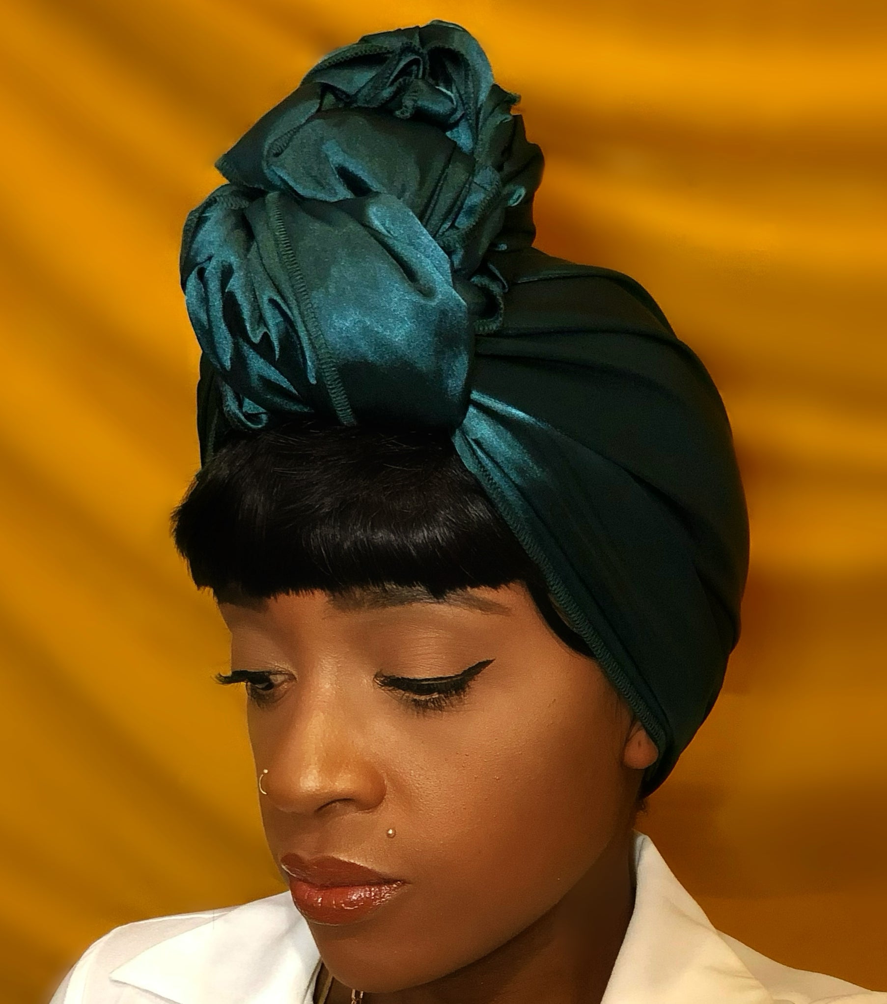 Women with bangs wearing teal satin headwrap with top knot - Vicky An Style 
